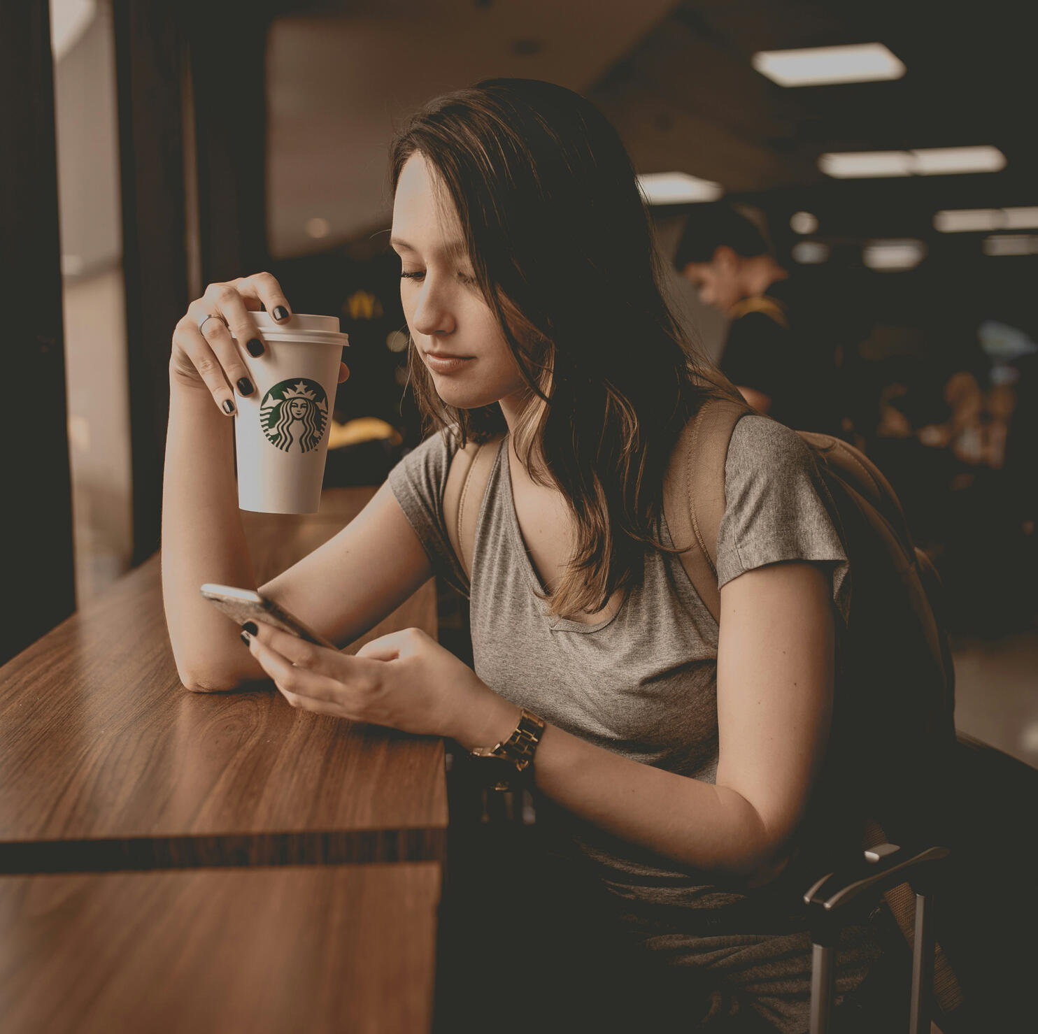 89Sites Small Biz Web Design - Girl Drinking Coffee and browsing on phone 89Sites Small Biz Web Design - Girl Drinking Coffee and browsing on phone